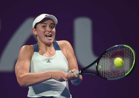 (200224) -- DOHA, Feb. 24, 2020 (Xinhua) -- Jelena Ostapenko of Latvia hits a return to Jil Teichmann of Switzerland during their women s singels first round match at 2020 WTA, Tennis Damen Qatar Open tennis tournament in Doha, Qatar, Feb. 23, 2020. (Photo by Nikku Xinhua) (SP)QATAR-DOHA-TENNIS-WTA-SINGLES 