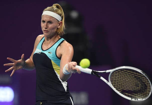 (200224) -- DOHA, Feb. 24, 2020 (Xinhua) -- Jil Teichmann of Switzerland hits a return to Jelena Ostapenko of Latvia during their women s singels first round match at 2020 WTA, Tennis Damen Qatar Open tennis tournament in Doha, Qatar, Feb. 23, 2020. (Photo by Nikku Xinhua) (SP)QATAR-DOHA-TENNIS-WTA-SINGLES 