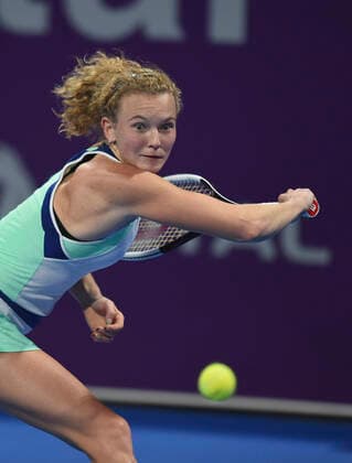 (200224) -- DOHA, Feb. 24, 2020 (Xinhua) -- Katerina Siniakova of the Czech Republic hits a return to Ons Jabeur of Tunisia during their women s singels first round match at 2020 WTA, Tennis Damen Qatar Open tennis tournament in Doha, Qatar, Feb. 23, 2020. (Photo by Nikku Xinhua) (SP)QATAR-DOHA-TENNIS-WTA-SINGLES 