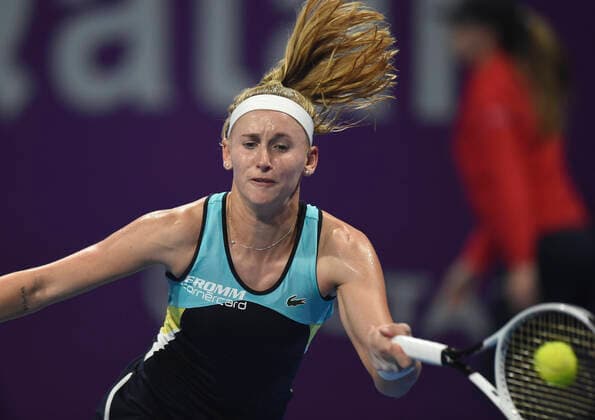 (200224) -- DOHA, Feb. 24, 2020 (Xinhua) -- Jil Teichmann of Switzerland hits a return to Jelena Ostapenko of Latvia during their women s singels first round match at 2020 WTA, Tennis Damen Qatar Open tennis tournament in Doha, Qatar, Feb. 23, 2020. (Photo by Nikku Xinhua) (SP)QATAR-DOHA-TENNIS-WTA-SINGLES 