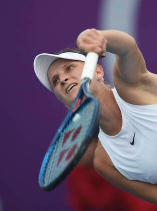 (200225) -- DOHA, Feb. 25, 2020 (Xinhua) -- Marketa Vondrousova of the Czech Republic serves during the women s singles second round match against Zheng Saisai of China at the 2020 WTA, Tennis Damen Qatar Open in Doha, Qatar, Feb. 24, 2020. (Photo by Nikku Xinhua) (SP)QATAR-DOHA-TENNIS-WTA-SINGLES 