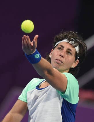 (200226) -- DOHA, Feb. 26, 2020 (Xinhua) -- Carla Suarez Navarro of Spain serves during the women s singles second round match against Petra Kvitova of the Czech Republic at the 2020 WTA, Tennis Damen Qatar Open in Doha, Qatar, Feb. 25, 2020. (Photo by Nikku Xinhua) (SP)QATAR-DOHA-TENNIS-WTA-SINGLES 