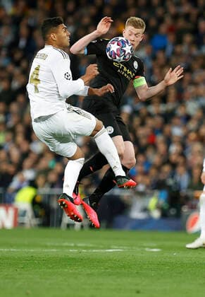 Real Madrid CF s Carlos H. Casemiro and Kevin De Bruyne of Manchester City competes for the ball during UEFA Champions League match, round of 16 first leg between Real Madrid and Manchester City at Santiago Bernabeu Stadium in Madrid, Spain. February Wednesday 26, 2020. (20190121214)