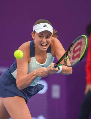 (200227) -- DOHA, Feb. 27, 2020 (Xinhua) -- Jelena Ostapenko of Latvia hits a return during the women s singles third round match against Petra Kvitova of the Czech Republic at the 2020 WTA, Tennis Damen Qatar Open in Doha, Qatar, Feb. 26, 2020. (Photo by Nikku Xinhua) (SP)QATAR-DOHA-TENNIS-WTA-SINGLES 