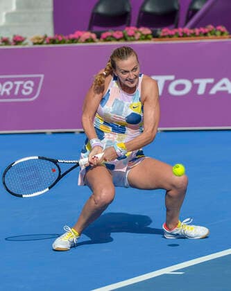 (200227) -- DOHA, Feb. 27, 2020 (Xinhua) -- Petra Kvitova of the Czech Republic hits a return during the women s singles third round match against Jelena Ostapenko of Latvia at the 2020 WTA, Tennis Damen Qatar Open in Doha, Qatar, Feb. 26, 2020. (Photo by Nikku Xinhua) (SP)QATAR-DOHA-TENNIS-WTA-SINGLES 