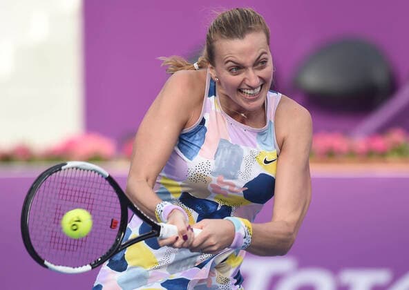 (200227) -- DOHA, Feb. 27, 2020 (Xinhua) -- Petra Kvitova of the Czech Republic hits a return during the women s singles third round match against Jelena Ostapenko of Latvia at the 2020 WTA, Tennis Damen Qatar Open in Doha, Qatar, Feb. 26, 2020. (Photo by Nikku Xinhua) (SP)QATAR-DOHA-TENNIS-WTA-SINGLES 