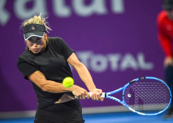 (200227) -- DOHA, Feb. 27, 2020 (Xinhua) -- Yulia Putintseva of Kazakhstan hits a return during the women s singles third round match against Belinda Bencic of Switzerland at the 2020 WTA, Tennis Damen Qatar Open in Doha, Qatar, Feb. 26, 2020. (Photo by Nikku Xinhua) (SP)QATAR-DOHA-TENNIS-WTA-SINGLES 