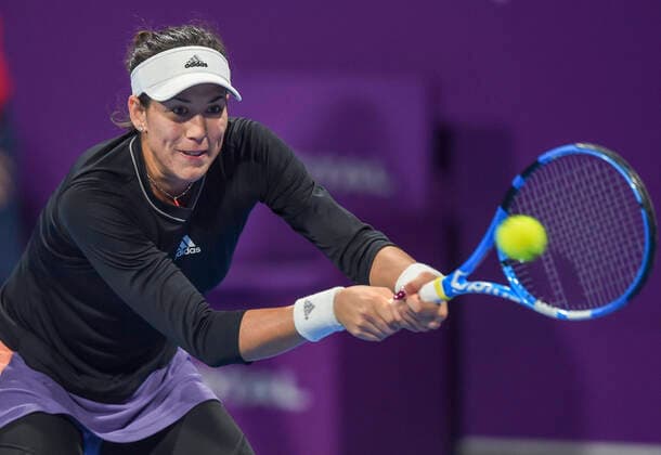 (200228) -- DOHA, Feb. 28, 2020 (Xinhua) -- Garbine Muguruza of Spain hits a return during the women s singles quarterfinal match against Ashleigh Barty of Australia at the 2020 WTA, Tennis Damen Qatar Open in Doha, Qatar, Feb. 27, 2020. (Photo by Nikku Xinhua) (SP)QATAR-DOHA-TENNIS-WTA-SINGLES 