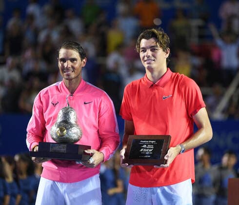 (200301) -- ACAPULCO, March 1, 2020 -- Rafael Nadal (L) of Spain poses with Taylor Fritz of the United States during the awarding ceremony of the men s singles at the 2020 ATP, Tennis Herren Mexican Open tennis tournament in Acapulco, Mexico, Feb. 29, 2020. ) (SP)MEXICO-ACAPULCO-TENNIS-ATP-MEXICAN OPEN-FINALS XinxYuewei 