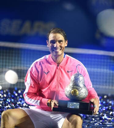 (200301) -- ACAPULCO, March 1, 2020 -- Rafael Nadal of Spain poses with his trophy during the awarding ceremony after winning the men s singles final match between Rafael Nadal of Spain and Taylor Fritz of the United States at the 2020 ATP, Tennis Herren Mexican Open tennis tournament in Acapulco, Mexico, Feb. 29, 2020. ) (SP)MEXICO-ACAPULCO-TENNIS-ATP-MEXICAN OPEN-FINALS XinxYuewei 