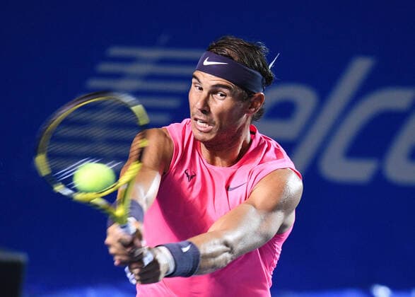 (200301) -- ACAPULCO, March 1, 2020 -- Rafael Nadal of Spain hits a return during the men s singles final match between Rafael Nadal of Spain and Taylor Fritz of the United States at the 2020 ATP, Tennis Herren Mexican Open tennis tournament in Acapulco, Mexico, Feb. 29, 2020. ) (SP)MEXICO-ACAPULCO-TENNIS-ATP-MEXICAN OPEN-FINALS XinxYuewei 