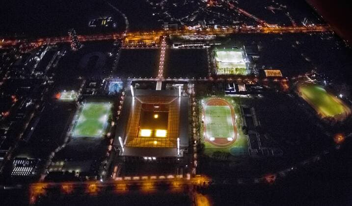 Nachtaufnahme des RheinEnergieStadions (Muengersdorfer Stadion) im Stadtteil Muengersdorf, Fussballstadion des 1. FC Koeln, 26.03.2013, Luftbild, Deutschland, Nordrhein-Westfalen, Koeln Night view of RheinEnergieStadium in the district Muengersdorf of 1. FC Koeln, 26.03.2013, aerial view, Germany, North Rhine-Westphalia, Cologne BLWS607669.jpg