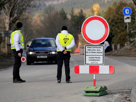 Staff control a driver outside the Vysocina Arena in Nove Mesto na Morave, South Moravia, Czech Republic, where the World Biathlon Cup will take place from March 5 to March 8, 2020, is seen on March 5, 2020. The cup will be held without the audience present in connection with the novel coronavirus outbreak. (CTKxPhoto LiborxPlihal) CTKPhotoP202003050747901 PLI 1