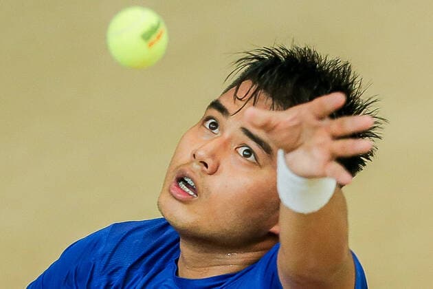 (200306) -- MANILA, March 6, 2020 -- Alberto Lim of the Philippines serves during the singles match against Stefanos Tsitsipas of Greece at Davis Cup World Group II play-off round between the Philippines and Greece in Manila, the Philippines on March 6, 2020. ) (SP)PHILIPPINES-MANILA-TENNIS-DAVIS CUP-GREECE VS PHILIPPINES ROUELLExUMALI 