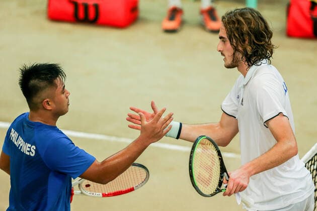 (200306) -- MANILA, March 6, 2020 -- Stefanos Tsitsipas (R) of Greece greets Alberto Lim of the Philippines after the singles match of Davis Cup World Group II play-off round between the Philippines and Greece in Manila, the Philippines on March 6, 2020. ) (SP)PHILIPPINES-MANILA-TENNIS-DAVIS CUP-GREECE VS PHILIPPINES ROUELLExUMALI 