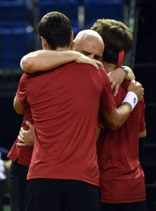 Belgian Joran Vliegen, Belgian captain Johan Van Herck and Belgian Sander Gille celebrate after winning a tennis double match between Hungarian Balazs Fucsovics and Belgian Gille Vliegen, the third rubber of the first round qualifiers in the Davis Cup World Group between Belgium and Hungary, Saturday 07 March 2020, in Debrecene, Hungary. ERICxLALMAND  x2485650x
