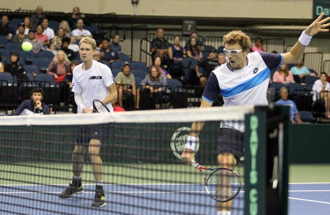 March 7, 2020 - Denis Istomin (UZB) returns volley at the net while Sanjar Fayziev (UZB) watches during a Davis Cup by Rakuten Qualifier doubles match between Sanjar Fayziev (UZB) Denis Istomin (UZB) and Bob Bryan (USA) Mike Bryan (USA) at the Neal Blaisdell Center in Honolulu, HI - CSM Honolulu USA - ZUMAc04_ 20200307_zaf_c04_289 Copyright: xMichaelxSullivanx