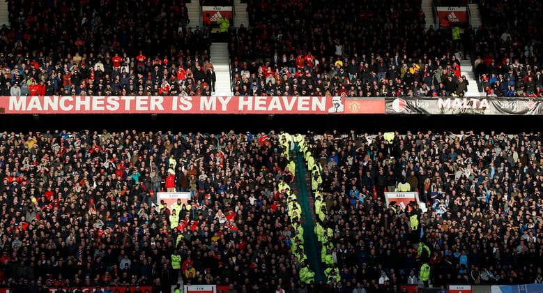 Both sets of fans bask in the late sunlight during the Premier League match at Old Trafford, Manchester. Picture date: 8th March 2020. Picture credit should read: Darren Staples Sportimage EDITORIAL USE ONLY. No use with unauthorised audio, video, data, fixture lists, club league logos or live services. Online in-match use limited to 120 images, no video emulation. No use in betting, games or single club league player publications. SPI-0537-0013