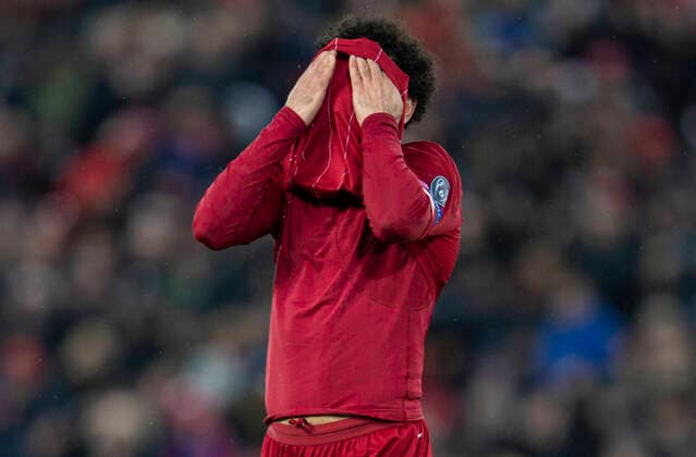 (200312) --LIVERPOOL, March 12, 2020 (Xinhua) -- Liverpool s Mohamed Salah reacts during the UEFA Champions league Round of 16 second leg football match between Liverpool and Atletico Madrid in Liverpool, Britain, March 11, 2020. FOR EDITORIAL USE ONLY. NOT FOR SALE FOR MARKETING OR ADVERTISING CAMPAIGNS. NO USE WITH UNAUTHORIZED AUDIO, VIDEO, DATA, FIXTURE LISTS, CLUB LEAGUE LOGOS OR LIVE SERVICES. ONLINE IN-MATCH USE LIMITED TO 45 IMAGES, NO VIDEO EMULATION. NO USE IN BETTING, GAMES OR SINGLE CLUB LEAGUE PLAYER PUBLICATIONS. (Str Xinhua) (SP)BRITAIN-LIVERPOOL-FOOTBALL-UEFA CHAMPIONS LEAGUE-LIVERPOOL VS ATLETICO MADRID