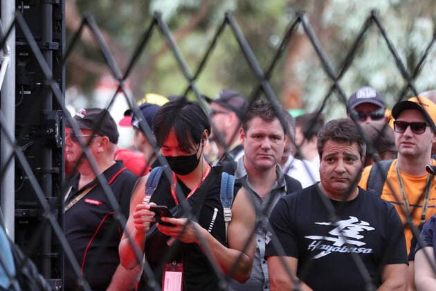 13th March 2020; Melbourne Grand Prix Circuit, Melbourne, Victoria, Australia; Formula One, Australian Grand Prix, Practice Day; Fan in a face mask wait to be let into the circuit while they wait for news  ActionPlus12217360 Octane