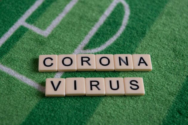 Germany 13 03 2020 Symbolic images Coronavirus The coronavirus causes cancellation of football matches of Bundesliga professionals, concerts or schools are closed Here The word coronavirus on a football carpet Germany