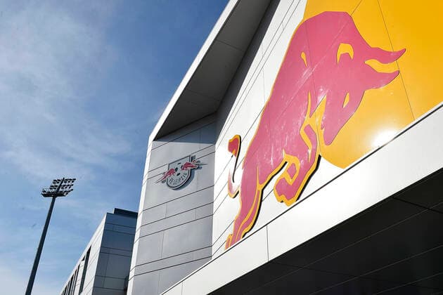 Soccer Bundesliga, Season 2019 2020, Red Bull training ground of RB Leipzig Entrance area of the Red Bull Academy of RB Leipzig with RBL logo and a bull, the Smybol picture of main sponsor Red Bull In the background left a floodlight mast of the training ground Leipzig Saxony Germany Red Bull Training Academy at Cottaweg