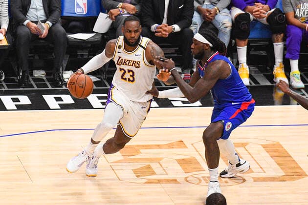 March 8, 2020, Los Angeles, CA, USA: LOS ANGELES, CA - MARCH 08: Los Angeles Lakers Forward LeBron James (23) drives to the basket against Los Angeles Clippers Center Montrezl Harrell (5) during a NBA, Basketball Herren, USA game between the Los Angeles Lakers and the Los Angeles Clippers on March 8, 2020 at STAPLES Center in Los Angeles, CA. ( Icon Sportswire) Los Angeles USA - ZUMAi88_ 20200308_zaf_i88_371 Copyright: xBrianxRothmullerx