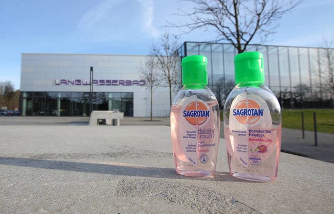 16 03 2020 Sports facility in times of corona virus Corona virus Corona virus DaMa symbol image symbol photo feature impression long water pool swimming pool indoor swimming pool bath exterior view closed entrance in times of corona virus Coronavirus disinfection hand gel disinfectant in the foreground