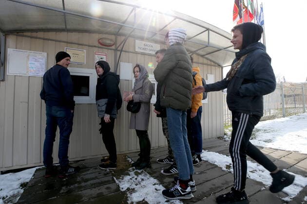MINSK REGION, BELARUS - MARCH 22, 2020: Fans seen by a ticket office ahead of a 2020 Belarusian Football Cup match between FC Slutsk and Slavia Mazyr at the City Stadium in the town of Slutsk. The Belarusian Football Federation has decided not to cancel the new season of the tournament amid the COVID-19 coronavirus pandemic. Natalia Fedosenko TASS  TS0D306D