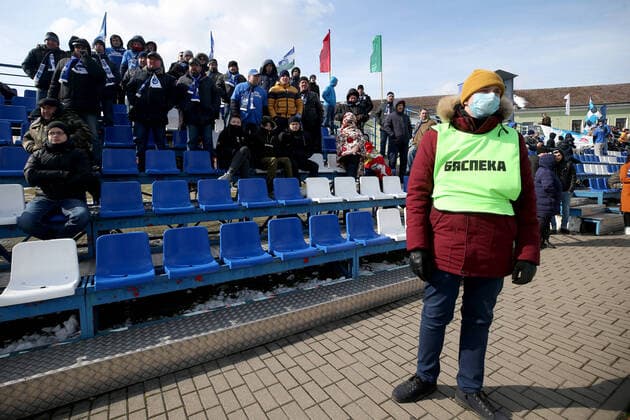 MINSK REGION, BELARUS - MARCH 22, 2020: Fans watch a 2020 Belarusian Football Cup match between FC Slutsk and Slavia Mazyr at the City Stadium in the town of Slutsk. The Belarusian Football Federation has decided not to cancel the new season of the tournament amid the COVID-19 coronavirus pandemic. Natalia Fedosenko TASS  TS0D3070