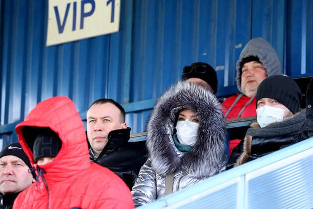 MINSK REGION, BELARUS - MARCH 22, 2020: Fans watch a 2020 Belarusian Football Cup match between FC Slutsk and Slavia Mazyr at the City Stadium in the town of Slutsk. The Belarusian Football Federation has decided not to cancel the new season of the tournament amid the COVID-19 coronavirus pandemic. Natalia Fedosenko TASS  TS0D3074