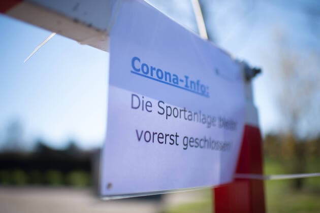 The corona virus Covid 19 causes events such as professional and amateur football matches to be cancelled indefinitely, with many consequences, see picture An information sheet Corona Info for a blocked sports facility Germany
