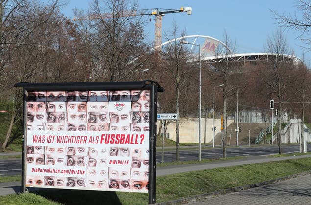 RBL Wir alle Leipzig, 26 03 2020, RB Leipzig Solidarity in the Corona Crisis What is more important than football We all The health of all goes before the campaign of football Bundesliga club RasenBallsport Leipzig , In the picture Wiralle poster In the background the Red Bull Arena ,