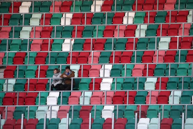 MINSK, BELARUS - APRIL 3, 2020: Football fans on an empty stand during a 2020 Belarusian Premier League Round 3 football match between Dinamo Minsk and Torpedo-Belaz Zhodino at Dinamo Stadium. The Football Federation of Belarus has decided not to postpone the national football championship in connection with the pandemic of the novel coronavirus, with the 30th season of the Belarusian Premier League starting as scheduled on 19 March 2020. Dinamo Minsk won the match 2-0. Natalia Fedosenko TASS  TS0D45E7