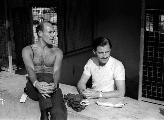 Sir STIRLING MOSS (17 September 1929 - 12 April 2020) was a British Formula One racing driver. An inductee into the International Motorsports Hall of Fame, he won 212 of the 529 races he entered across several categories of competition and has been described as the greatest driver never to win the World Championship, WM, Weltmeisterschaft . Moss died at his home in Mayfair, London on 12 April 2020, at age 90, after a long illness. PICTURED: September 16, 1962, Monza, Italy: Drivers STIRLING MOSS (left), and GRAHAM HILL, in the pit lane before the 1962 Italian Grand Prix. Moss was attending as a spectator, for the first time following serious injuries sustained earlier in the season. Monza Italy - ZUMAs04_ 19620916_mda_s04_342 Copyright: xDavidxPhippsx