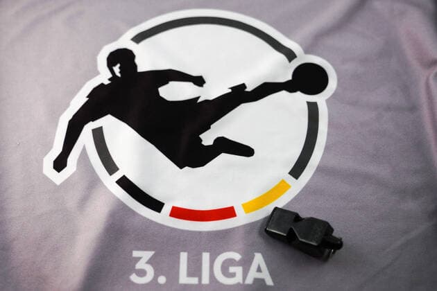 What should happen to football in the 3 League due to the difficult situation with the coronavirus, play on or end of season, the photo shows the logo of the 3 League and a referees whistle on a grey bodice, league logo and lettering, symbol photo, symbol image, symbol, 22 04 2020, Heidelberg Germany , feature, football, symbol images of the 3 League xozx