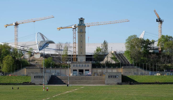Red Bull Arena Leipzig, 22 04 2020, View of the Red Bull Arena, home of the Bundesliga football club RasenBallsport Leipzig RB Leipzig , In the picture outside view of the Red Bull Arena with bell tower and three tower cranes This week the third crane in the picture on the left was mounted ,