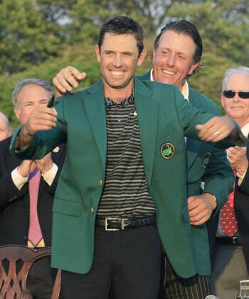 Golf: Charl Schwartzel, Phil Mickelson Charl Schwartzel of South Africa receives the Masters green jacket from Phil Mickelson of the United States after winning the tournament in Augusta, Georgia, on April 10, 2011. 