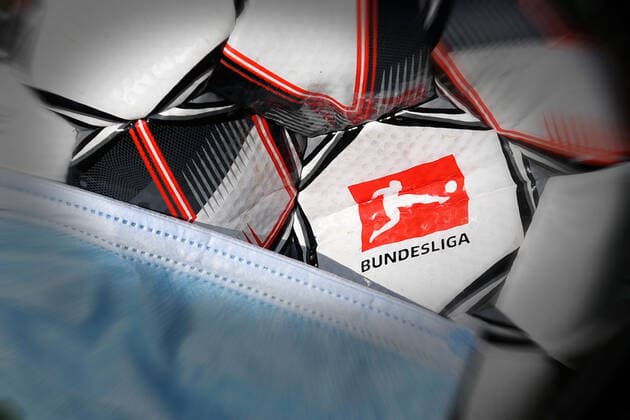 DFL reports a total of ten positive corona tests in the 1 and 2 Bundesliga Archive photo Theme photo Feature Consequences of the corona pandemic on professional sports and the football leagues It is completely open how the game will continue when and if it will be possible to play again at all Now the DFL is planning to continue the game from 9 May 2020 Logo of the Bundesliga on the official match ball Derbystar The ball is wearing a protective mask, mouth guard, mouth mask Football 1 Bundesliga Â