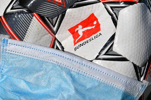 DFL reports a total of ten positive corona tests in the 1 and 2 Bundesliga Archive photo Theme photo Feature Consequences of the corona pandemic on professional sports and the football leagues It is completely open how the game will continue when and if it will be possible to play again at all Now the DFL is planning to continue the game from 9 May 2020 Logo of the Bundesliga on the official match ball Derbystar The ball is wearing a protective mask, mouth guard, mouth mask Football 1 Bundesliga Â
