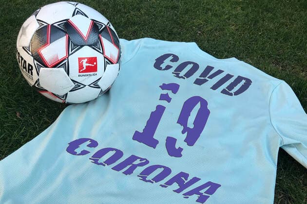 PHOTOMONTAGE DFL reports a total of ten positive corona tests in the 1 and 2 Bundesliga Archive photo The official match ball DERBYSTAR of the German Soccer League lies on a jersey with the back number 19 and the inscription COVID 19,Corona Fussball 1 Bundesliga Â