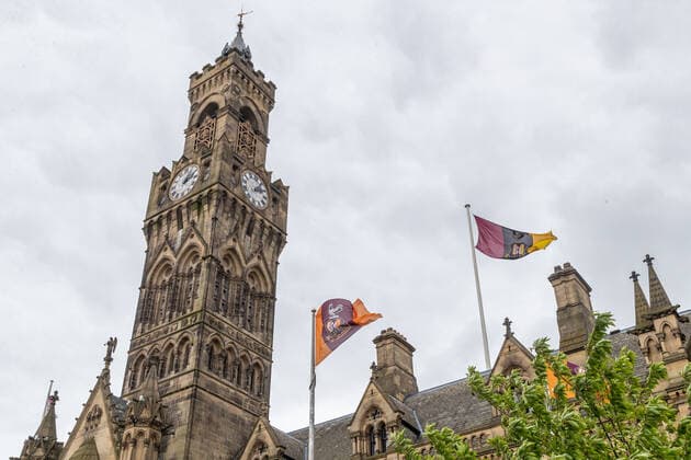 Bradford City flags fly outside Bradford City Hall in honour of the 35th anniversary of the fire at Valley Parade which claimed 56 lives. The Bradford City stadium fire occurred during an English League Third Division match between Bradford City and Lincoln City on Saturday, 11 May 1985, killing 56 spectators in the stadium and injuring at least 265. Copyright: xThomasxGaddx PMI-3473-0011