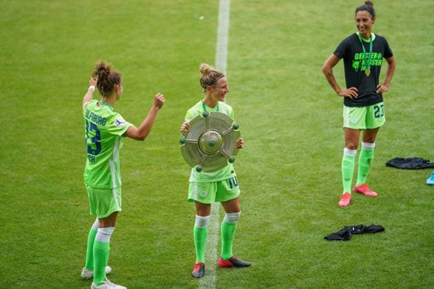 WOLFSBURG, GERMANY, JUN 28: Felicitas Rauch of Vfl Wolfsburg (left) and Svenja Huth celebrating the winning of the championship with the trophy after the Womens Bundesliga football match between VfL Wolfsburg and Bayer 04 Leverkusen. Daniela Porcelli SPP VfL Wolfsburg v Bayer 04 Leverkusen 