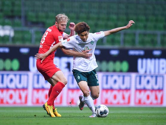 Werder Bremen 1 FC Heidenheim Football, Relegation, Werder Bremen 1 FC Heidenheim Duel Yuya Osako Bremen v Sebastian Griesbeck Heidenheim Photo Marvin Ibo Güngör GES Pool via xim gs DFL regulations prohibit any use of photographs as image sequences and or quasi video Editorial use only National and international news agencies out Bremen Germany Poolfoto Marvin Ibo Güngör GES Pool via xim.gs ,EDITORIAL USE ONLY