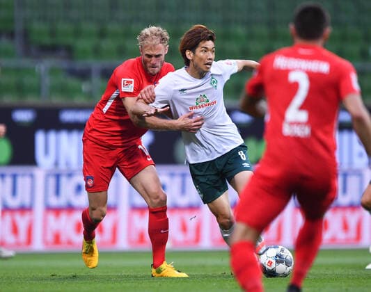 Werder Bremen 1 FC Heidenheim Football, Relegation, Werder Bremen 1 FC Heidenheim Duel Yuya Osako Bremen v Sebastian Griesbeck Heidenheim Photo Marvin Ibo Güngör GES Pool via xim gs DFL regulations prohibit any use of photographs as image sequences and or quasi video Editorial use only National and international news agencies out Bremen Germany Poolfoto Marvin Ibo Güngör GES Pool via xim.gs ,EDITORIAL USE ONLY