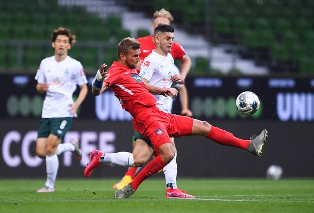 Werder Bremen 1 FC Heidenheim Football, Relegation, Werder Bremen 1 FC Heidenheim Duel Timo Beermann Heidenheim v Milot Rashica Bremen Photo Marvin Ibo Güngör GES Pool via xim gs DFL regulations prohibit any use of photographs as image sequences and or quasi video Editorial use only National and international news agencies out Bremen Germany Poolfoto Marvin Ibo Güngör GES Pool via xim.gs ,EDITORIAL USE ONLY