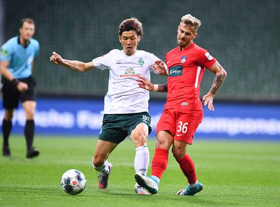 Werder Bremen 1 FC Heidenheim Football, Relegation, Werder Bremen 1 FC Heidenheim Duel Yuya Osako Bremen v Niklas Dorsch Heidenheim Photo Marvin Ibo Güngör GES Pool via xim gs DFL regulations prohibit any use of photographs as image sequences and or quasi video Editorial use only National and international news agencies out Bremen Germany Poolfoto Marvin Ibo Güngör GES Pool via xim.gs ,EDITORIAL USE ONLY