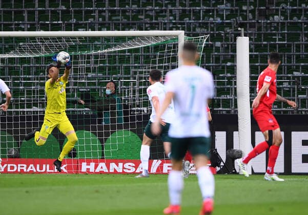 Werder Bremen 1 FC Heidenheim Football, Relegation, Werder Bremen 1 FC Heidenheim Goalkeeper Jiri Pavlenka Bremen parries a shot by Tim Kleindienst Heidenheim Photo Marvin Ibo Güngör GES Pool via xim gs DFL regulations prohibit any use of photographs as image sequences and or quasi video Editorial use only National and international news agencies out Bremen Germany Poolfoto Marvin Ibo Güngör GES Pool via xim.gs ,EDITORIAL USE ONLY