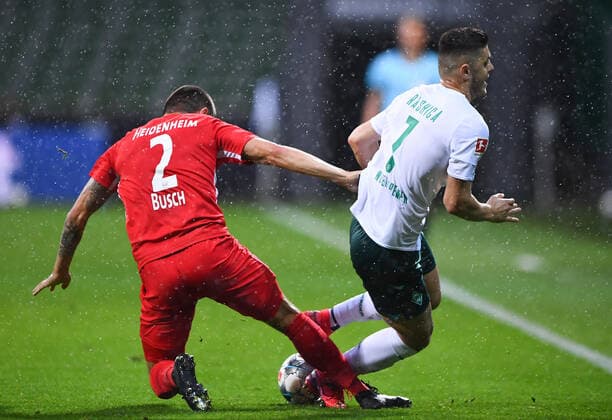 Werder Bremen 1 FC Heidenheim Football, Relegation, Werder Bremen 1 FC Heidenheim Duel in the rain Milot Rashica Bremen against Marnon Busch Heidenheim Photo Marvin Ibo Güngör GES Pool via xim gs DFL regulations prohibit any use of photographs as image sequences and or quasi video Editorial use only National and international news agencies out Bremen Germany Poolfoto Marvin Ibo Güngör GES Pool via xim.gs ,EDITORIAL USE ONLY