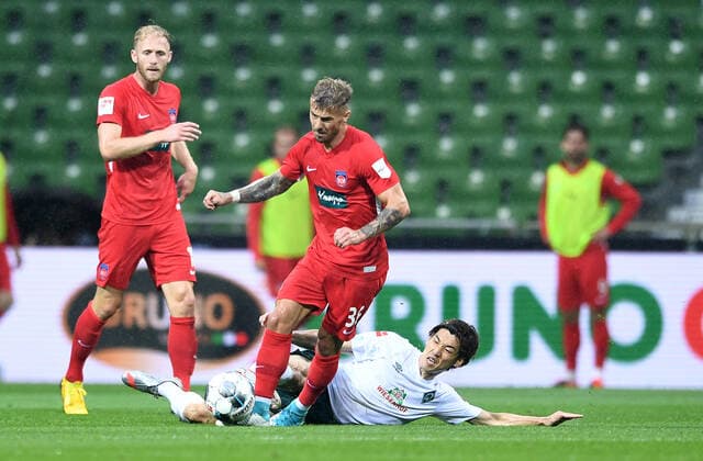 Werder Bremen 1 FC Heidenheim Football, Relegation, Werder Bremen 1 FC Heidenheim v l Sebastian Griesbeck, Niklas Dorsch, Yuya Osako Bremen Photo Tim Groothuis Witters Pool via xim gs DFL regulations prohibit any use of photographs as image sequences and or quasi video Editorial use only National and international news agencies out Bremen Germany Poolfoto Tim Groothuis Witters Pool via xim.gs ,EDITORIAL USE ONLY